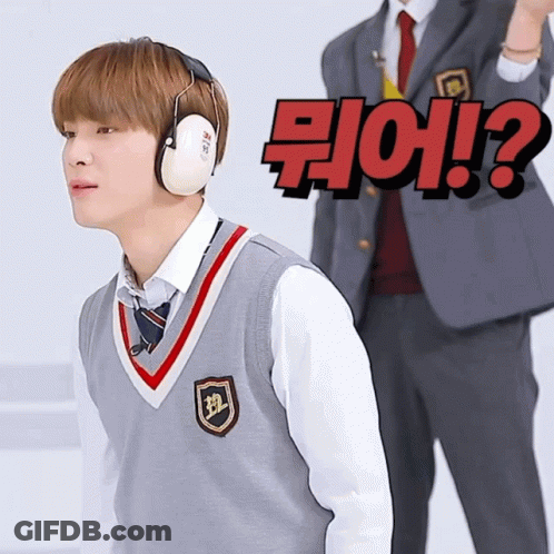 Boy In Ear Muffs Facing Man In Suit With Question Mark GIF