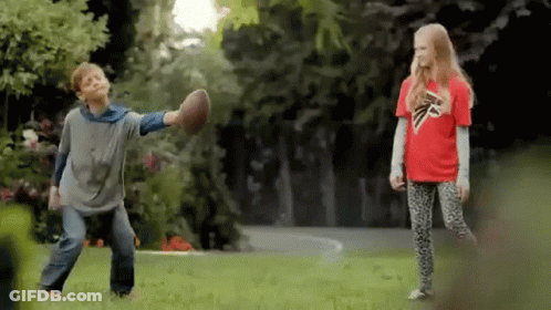 Boy In Falcons Shirt Playing Football With Girl GIF