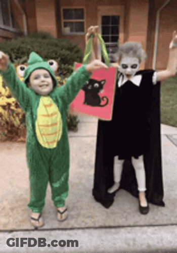 Boy In Frog Costume And Girl In Black Cat Costume GIF