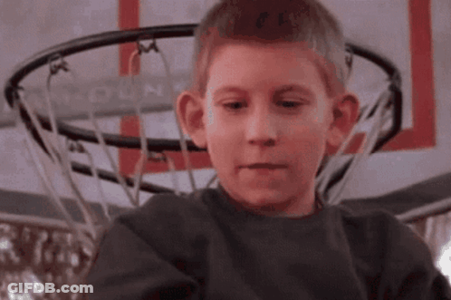 Boy In Front Of Basketball Hoop Saying Hoop GIF