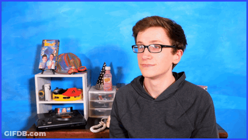 Boy In Glasses Blue Wall GIF