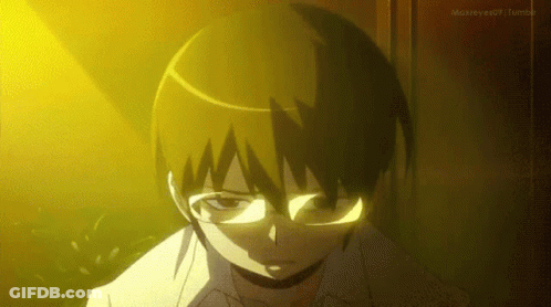 Boy In Glasses Standing Before Yellow Light GIF