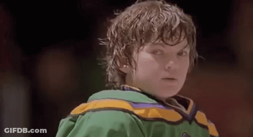 Boy In Green And Yellow Hockey Jersey On Rink GIF