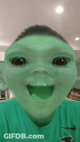 Boy In Green Nike Shirt Making Funny Face GIF