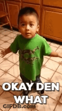 Boy In Green Shirt Making Funny Face GIF