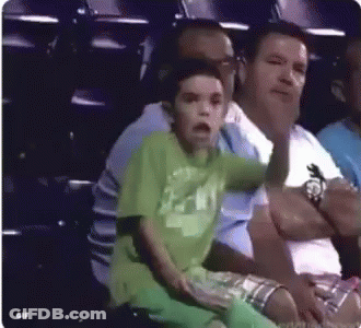 Boy In Green Shirt With Man At Stadium GIF