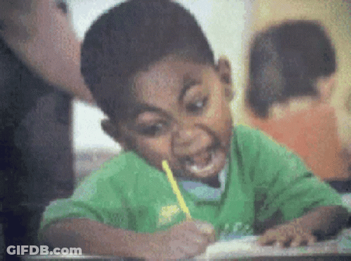 Boy In Green Shirt Writing With Pencil GIF