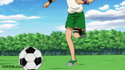 Boy In Green Shorts Kicking Soccer Ball GIF