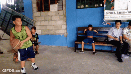 Boy In Green Under Armour Tank Top Holding Basketball GIF