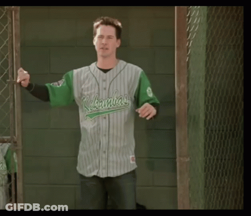 Boy In Green White Baseball Uniform Holding Bat GIF