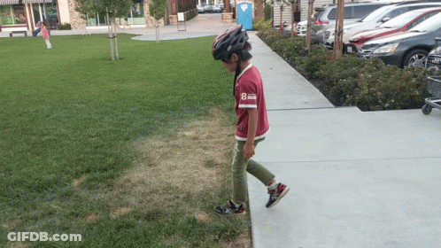 Boy In Helmet And Red Shirt Number 8 GIF