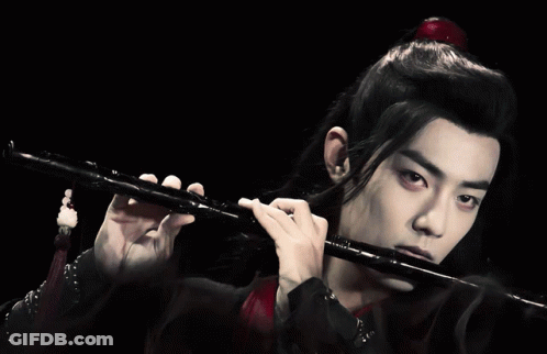 Boy In Kimono Playing Flute Blue Polka Dots GIF