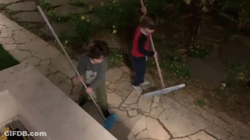 Boy In Mickey Mouse Shirt Sweeping GIF