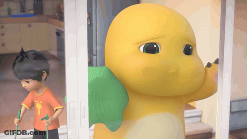 Boy In Orange Shirt With Letter T GIF