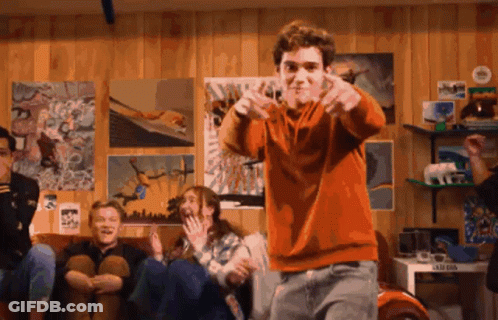 Boy In Orange Sweater Dancing In Front Of Kids GIF