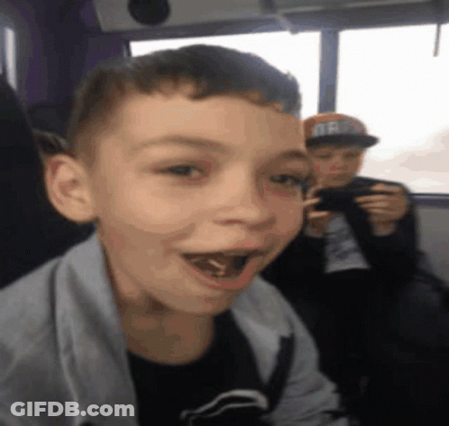 Boy In Oregon Hat Looking At Camera GIF