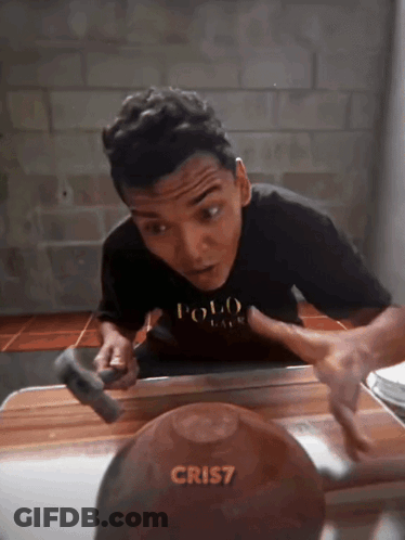 Boy In Polo Shirt Holding Hammer GIF