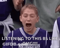 Boy In Purple Basketball Jersey Screaming In Crowd GIF