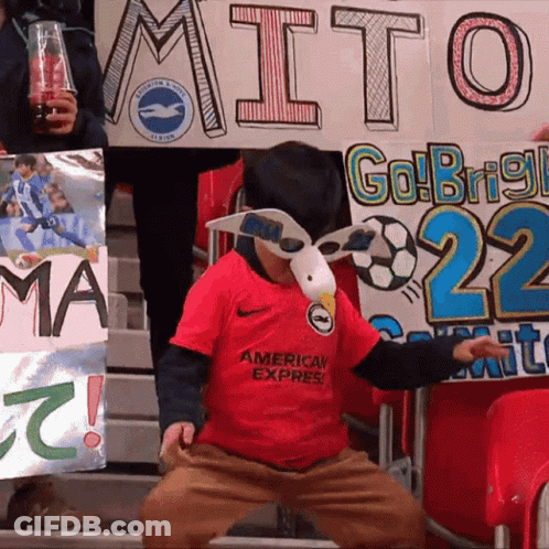 Boy In Red American Express Shirt In Crowd GIF