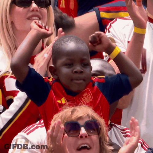 Boy In Red And Blue Jersey With Crown GIF