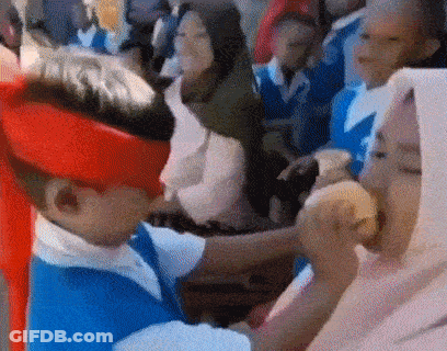Boy In Red Hat And Blue Shirt Eating Hamburger GIF