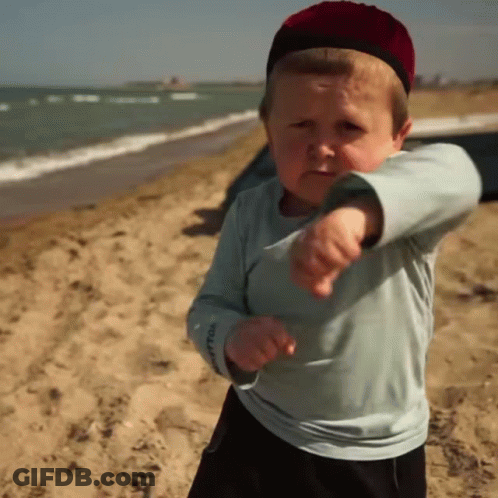 Boy In Red Hat Pointing At Camera GIF