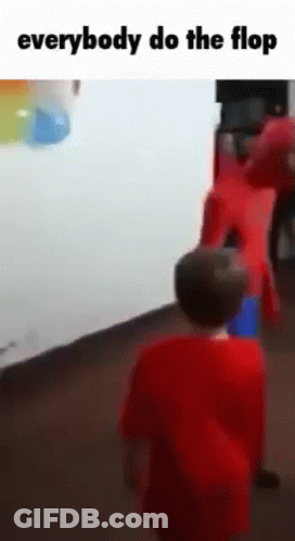 Boy In Red Shirt In Front Of Group GIF
