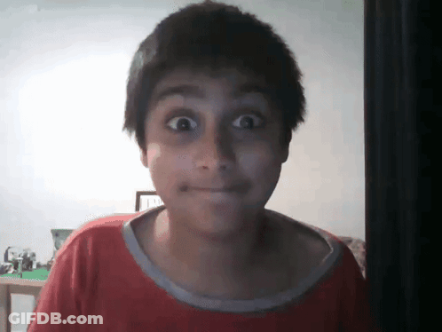 Boy In Red Shirt Making Funny Face GIF