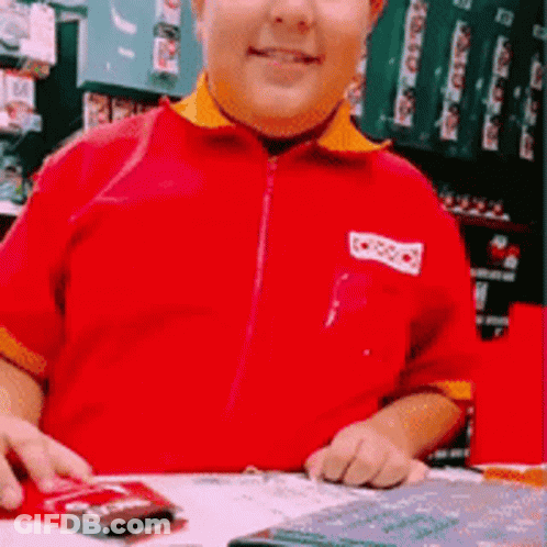 Boy In Red Shirt Saying Coca Cola GIF