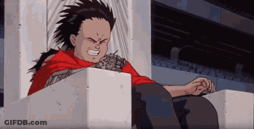 Boy In Red Shirt Sitting On Concrete Block GIF