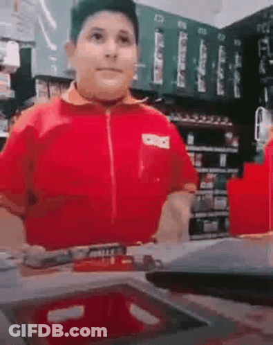 Boy In Red Shirt Standing In Store GIF