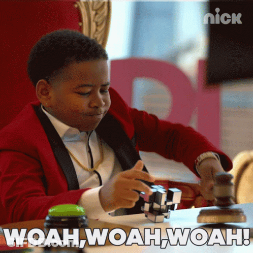 Boy In Red Suit Playing Puzzle Saying Woah Woah Woah GIF