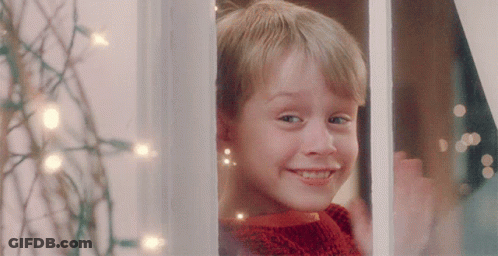 Boy In Red Sweater Smiling Out Window GIF