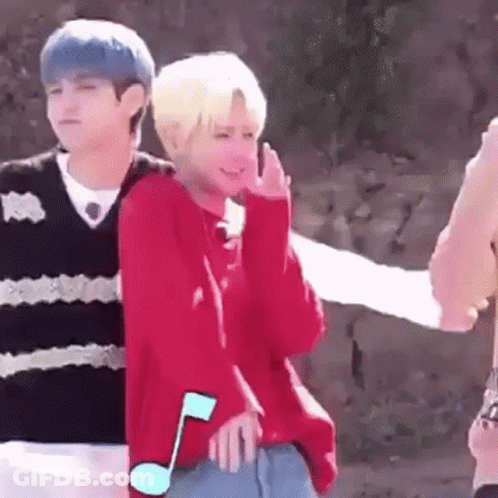 Boy In Red Sweater Standing Next To Boy In Black Sweater GIF