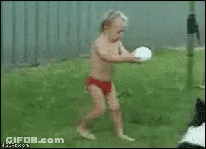 Boy In Red Swim Trunks Running Toward Frisbee GIF
