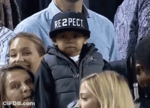 Boy In Respect Hat In Crowd GIF