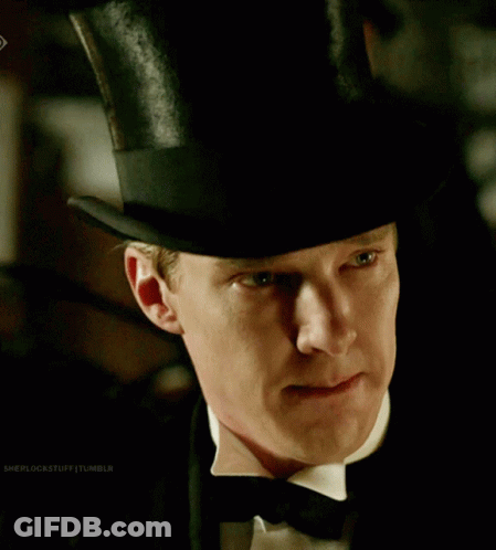 Boy In Respect Hat Sitting In Crowd GIF