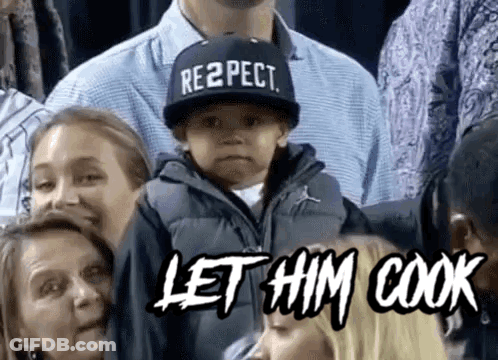 Boy In Respect Hat Sitting In Crowd GIF