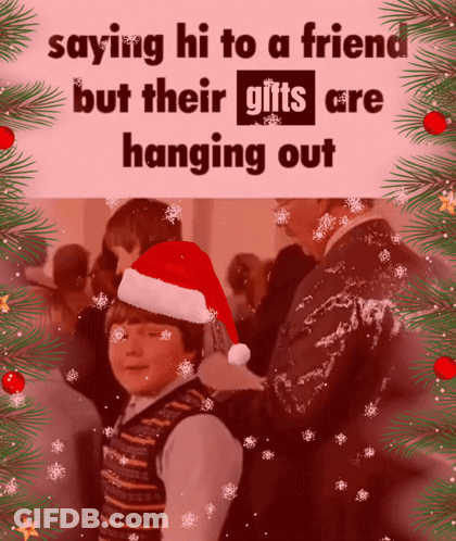 Boy In Santa Hat Saying Hi To Friend With Gifts GIF