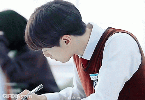 Boy In School Uniform Writing In Notebook GIF