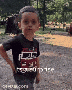 Boy In Shirt Saying It's A Surprise Hands On Hips GIF