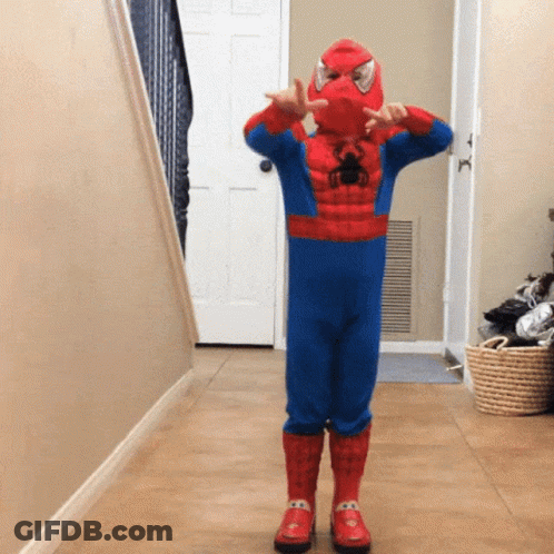 Boy In Spiderman Costume In Hallway GIF