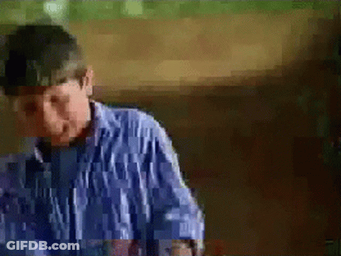 Boy In Striped Shirt Making Funny Face GIF