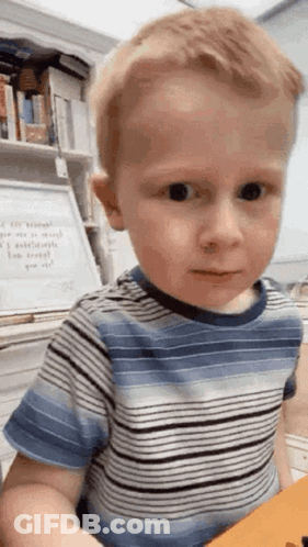 Boy In Striped Shirt Making Funny Face GIF