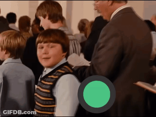 Boy In Striped Vest In Crowd With Green Circle GIF
