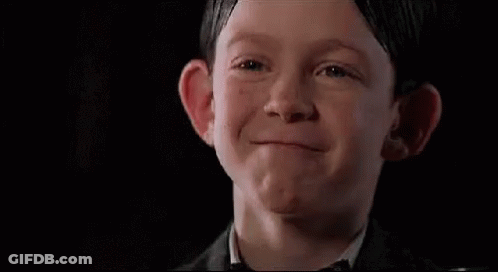 Boy In Suit And Bow Tie Making Face GIF