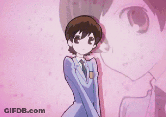 Boy In Suit And Tie In Front Of Pink Wall GIF