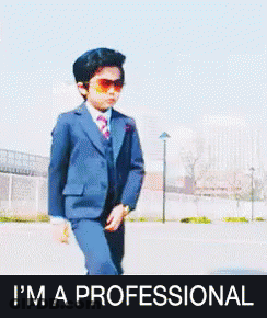 Boy In Suit Kicking Saying I'm A Professional GIF