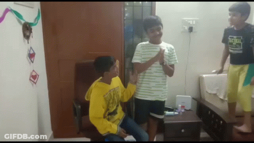 Boy In Tactical Shirt Standing Next To Two Boys GIF