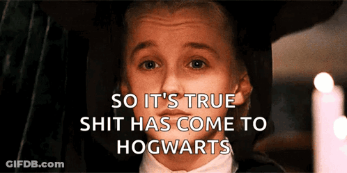 Boy In Tuxedo Behind Hogwarts Words GIF